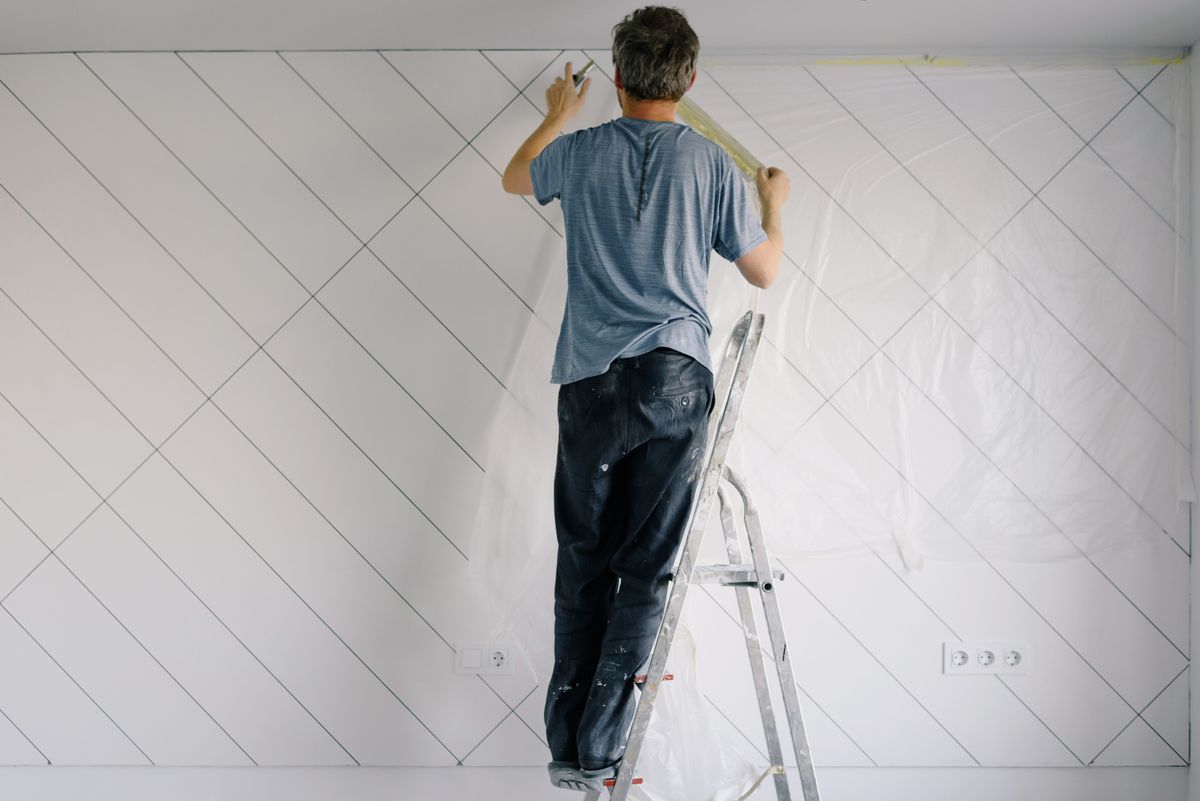 Handyman repairing and finishing a residential interior